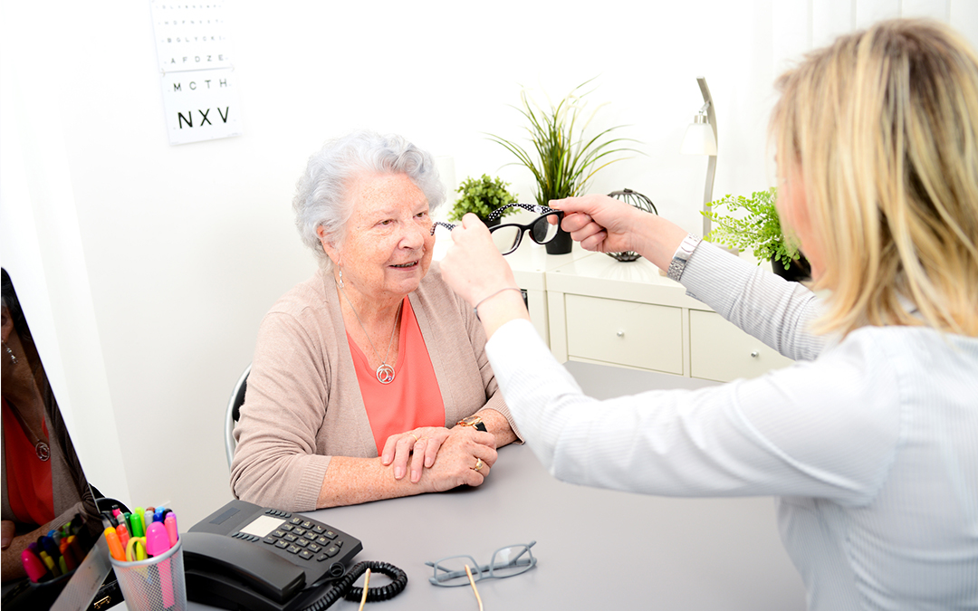 Optician with a senior patient